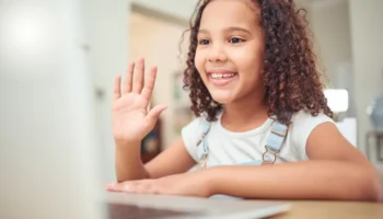 smiling-girl-waving-during-video-call-2026-01-09-09-49-56-utc remote work r1