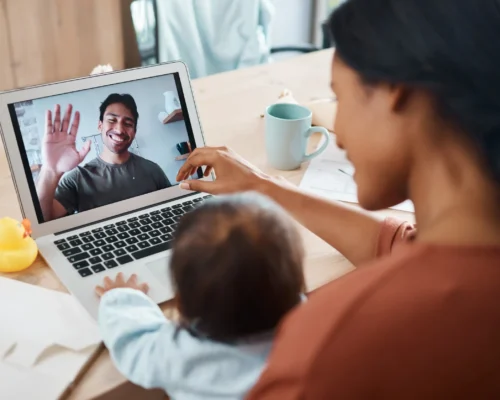 wgs-blogs-remote-work-woman-and-baby-on-video-call-with-man-2026-01-09-10-22-34-utc-scaled-500x400-v01 mother remote working on video call with a man
