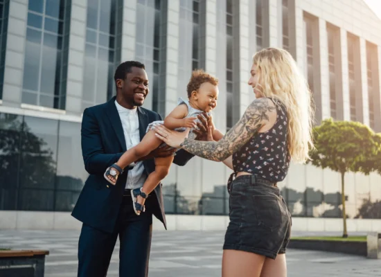 wgs-blogs-loving-parents-hold-infant-outdoors-in-city-2026-01-07-01-16-29-utc-1-scaled-550x400-v01 loving parents hold infant outdoors in city