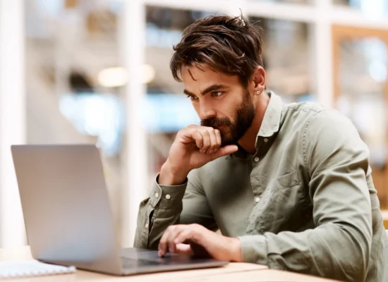 thoughtful-man-working-on-laptop-in-office-2026-01-09-09-52-39-utc Virtual Divorce Mediation 2